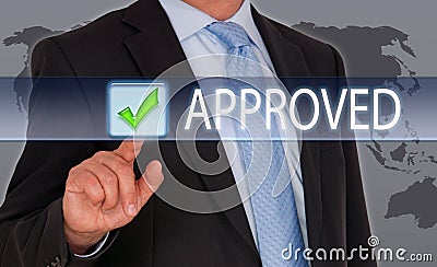 Manager pressing tick on touch screen Stock Photo