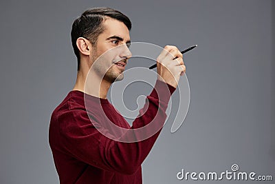 manager in a sweater with pen posing emotions business and office concept Stock Photo