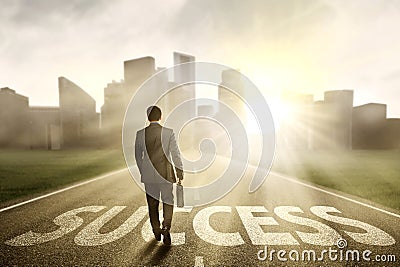 Manager walking on the road to success Stock Photo