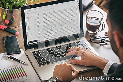 Manager working with a computer, Gmail on the screen Editorial Stock Photo