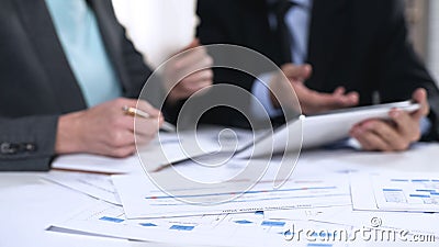 Managers checking information in tablet, online register, technology in business Stock Photo