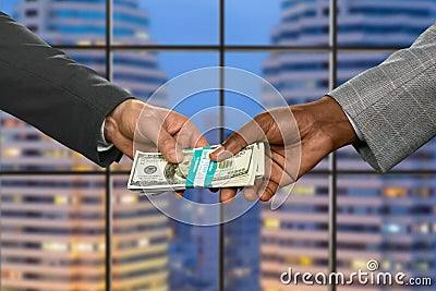 Managers pass money in megalopolis. Stock Photo