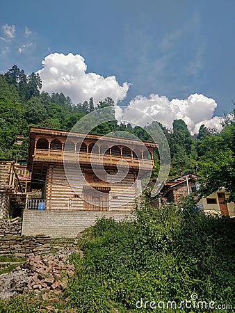 Manali, India - June 10th 2019: Beautiful architecture of traditional Indian Himalayan mountain village temple. Editorial Stock Photo