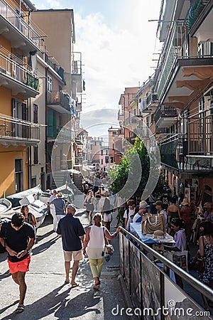 Manarola ITALY - 2 August 2023 - Crowd of tourists in street of village Editorial Stock Photo