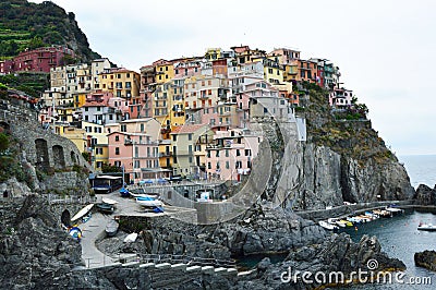 Manarola town with its colorful traditional houses on the rocks over Mediterranean sea, Cinque Terre National Park and UNESCO Stock Photo