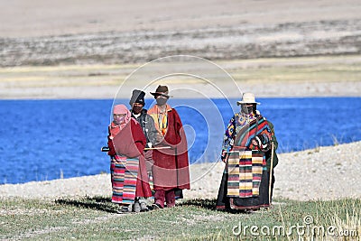 Manasarovar, Tibet, China, June, 14, 2018. Pilgrims make Kora around lake Manasarovar in Tibet Editorial Stock Photo