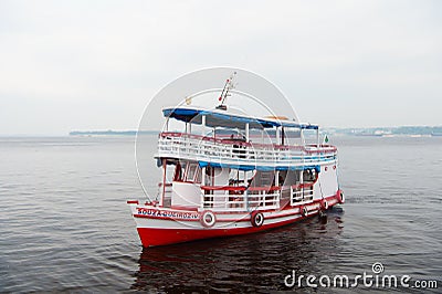 Manaus, Brazil - December 04, 2015: pleasure boat float along sea coast. Holiday cruiser ship on seascape. Summer vacation and tra Editorial Stock Photo