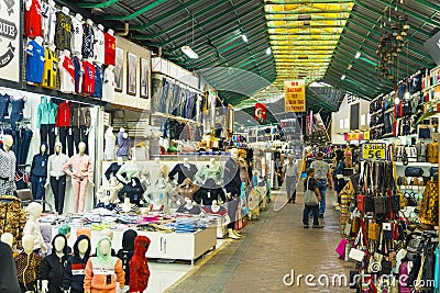 10.11.2022 Manavgat, Turkey - Bazaar. Locals and tourists doing shopping at busy market place. Clothing and accessories Editorial Stock Photo