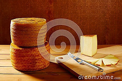 Manchego cheese from Spain in wooden table Stock Photo