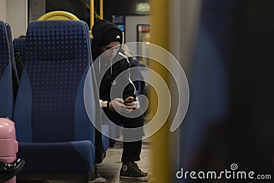 A young boy types a message on his smartphone, Manchester, UK Editorial Stock Photo