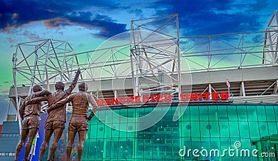 The United Trinity bronze sculpture at Old Trafford Stadium in Manchester, UK. Manchester United Editorial Stock Photo