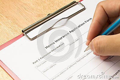 Mand fill the home insurance application form Stock Photo