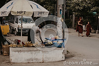 Mandalay Myanmar , a group of Burmese people passing through a street Editorial Stock Photo