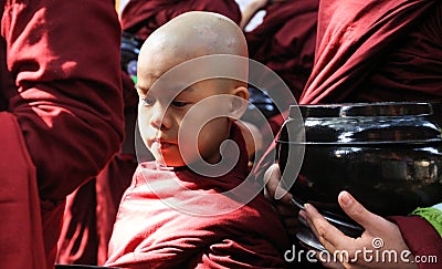 MANDALAY, MYANMAR - DECEMBER 18. 2015: Procession of Buddhist monks at Mahagandayon Monastery in the early morning Editorial Stock Photo