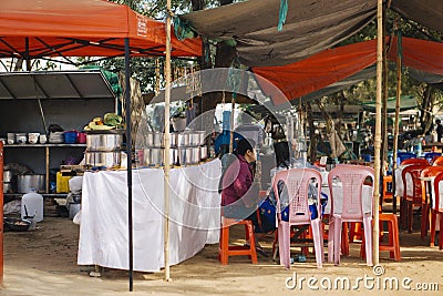 Mandalay ,Myanmar 09/02/2020 Two womans sitiing and talking at street food shop ,coffee shop at Mandalay Editorial Stock Photo