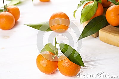 Mandarin Oranges on rustic white wooden background Stock Photo