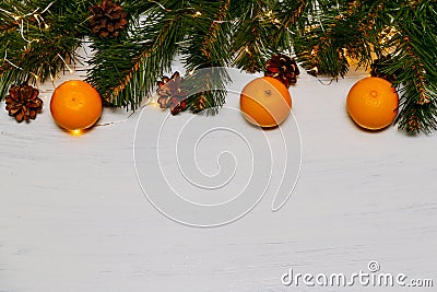 Mandarine fruits and christmas tree branches over rustic wooden background. Christmas concept Stock Photo