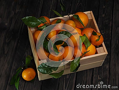 Mandarins in a wooden box Stock Photo