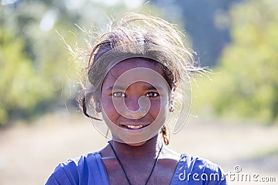 Portrait poor girl on the street in Indian village Mandu, India Editorial Stock Photo