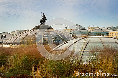 Manezhnaya Square. Glass domes of an underground shopping center with a Monument of holy patron Editorial Stock Photo