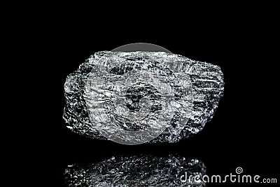 Manganese ore, raw rock on black background, mining and geology Stock Photo