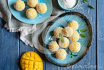 Mango Coconut Ladoo â€“ sweet balls made of mango puree, desiccated coconut and condensed milk Stock Photo