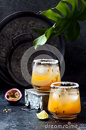 Mango passionfruit margarita cocktail with lime. Tropical alcoholic drink for summer Stock Photo