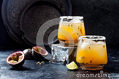 Mango passionfruit margarita cocktail with lime. Tropical alcoholic drink for summer Stock Photo