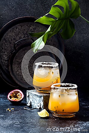 Mango passionfruit margarita cocktail with lime. Tropical alcoholic drink for summer Stock Photo