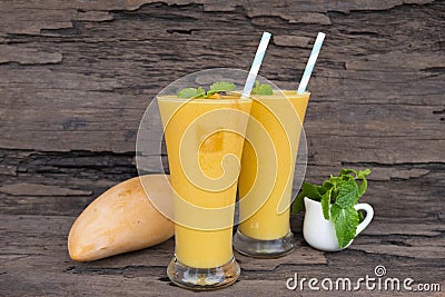 Mango smoothies juice and fruit mango from the wood background Stock Photo