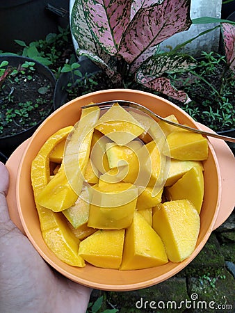 This mango is sweet like your smile on payday Stock Photo