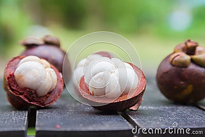 Mangosteens on a wooden table Stock Photo