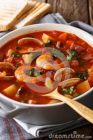 Manhattan chowder soup with shellfish and bacon close-up on Stock Photo