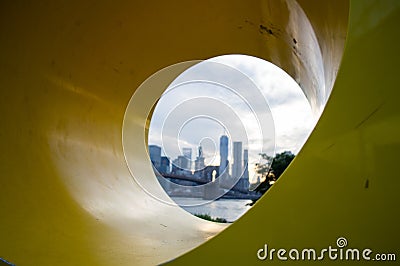 Manhattan Downtown Financial District Skyline and Brooklyn Bridge as Seen Through Yo Sculpture from Mainstreet Park in Brooklyn Stock Photo