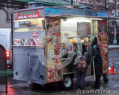 Manhattan, New York, NY, USA - Children buying some street food at the food stand. Editorial Stock Photo