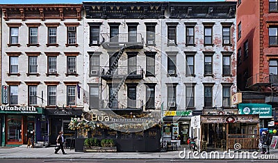 Second Avenue, old apartment buildings and ethnic restaurants Editorial Stock Photo