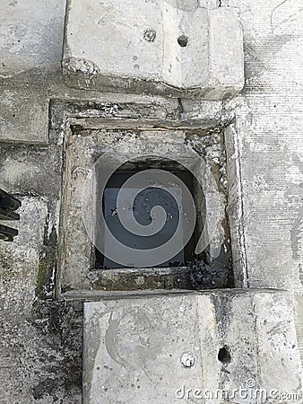 Manhole cover open in street and repair of roads. Accident with sewer hatch in city. Concept of sewage, underground utilities Stock Photo