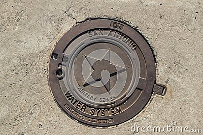 Manhole Cover In San Antonio Stock Photo
