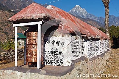 Mani prayer walls and prayer wheels in Khumbu valley Stock Photo