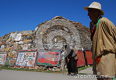 Mani stone wall in Tibet Editorial Stock Photo