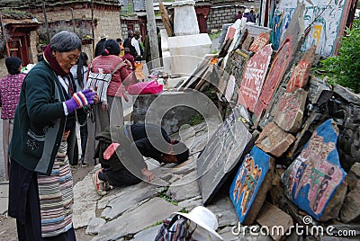 Mani stone wall in Tibet Editorial Stock Photo
