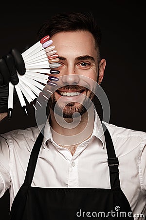 Manicur master man in working form with tools in hand. Nail photo content Stock Photo