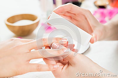 Manicure with buffer at nail salon Stock Photo