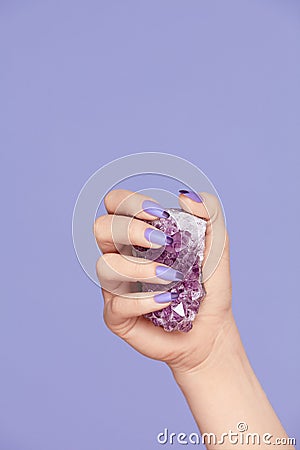 Manicure. Hand With Stylish Nails Holding Purple Gemstone Stock Photo