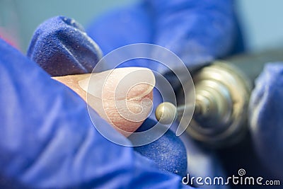 Manicure process, cleaning nails with a milling cutter close up Stock Photo