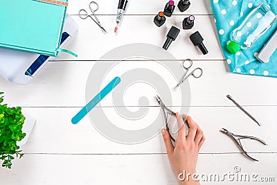 Manicure set and nail polish on wooden background Stock Photo