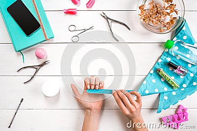 Manicure set and nail polish on wooden background Stock Photo