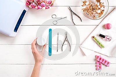 Manicure set and nail polish on wooden background Stock Photo