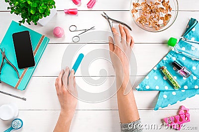 Manicure set and nail polish on wooden background Stock Photo