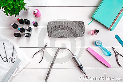 Manicure set and nail polish on wooden background Stock Photo